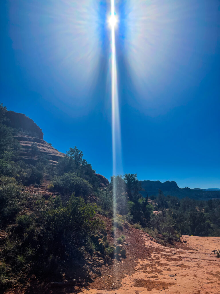 iPhone travel photo of sun flare above red rock in Sedona Arizona