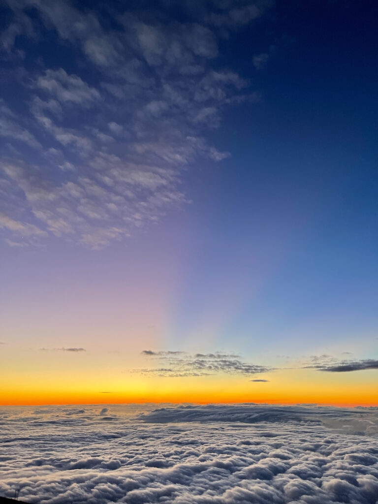 iPhone travel photo of sunset above clouds on Haleakala Volcano in Maui, Hawaii